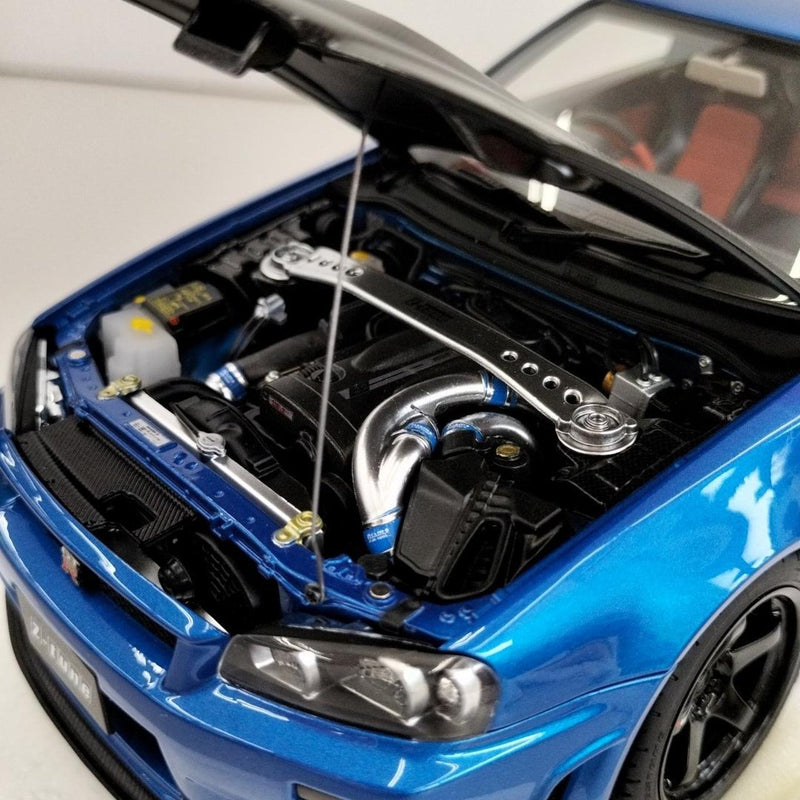 Laden Sie das Bild in Galerie -Viewer, AUTOart 1/18 Nismo R34 GT-R Z-tune (Bayside Blue/Carbon Black Hood)– Used