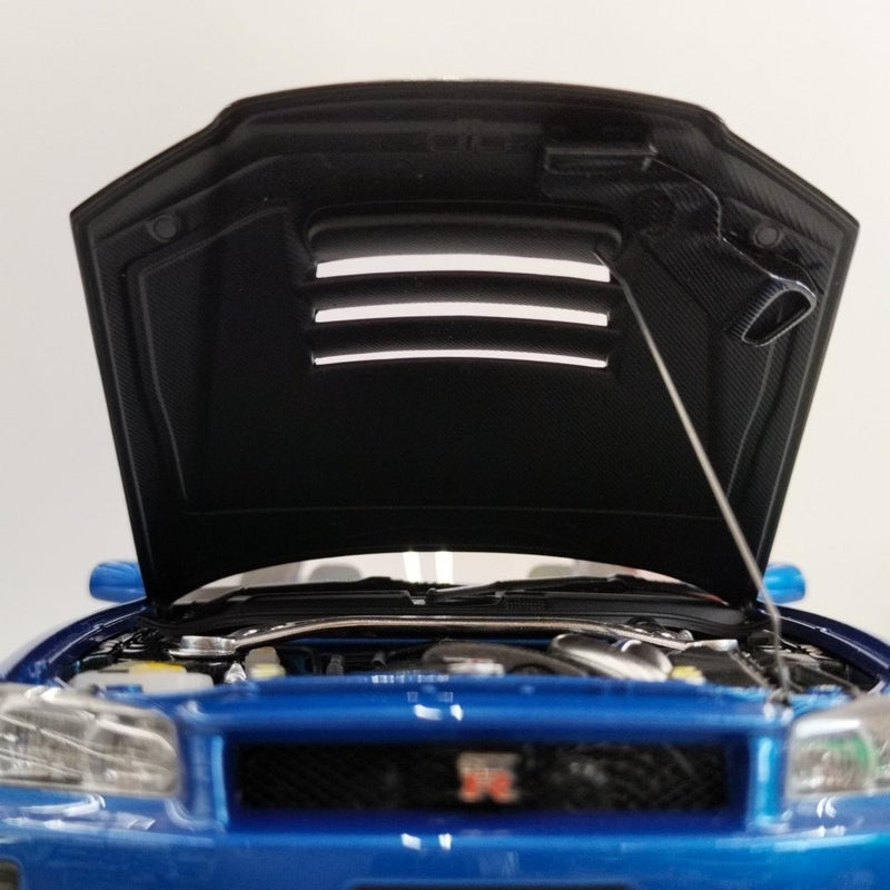 Laden Sie das Bild in Galerie -Viewer, AUTOart 1/18 Nismo R34 GT-R Z-tune (Bayside Blue/Carbon Black Hood)– Used