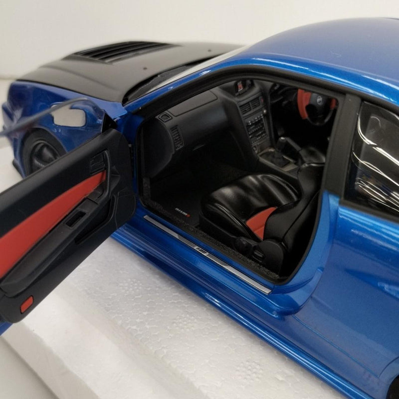 Laden Sie das Bild in Galerie -Viewer, AUTOart 1/18 Nismo R34 GT-R Z-tune (Bayside Blue/Carbon Black Hood)– Used