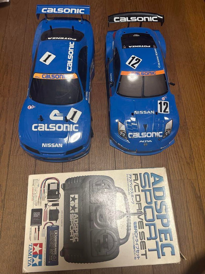Load image into Gallery viewer, Used Tamiya Calsonic Skyline GT-R R33 RC Car with Z33 Body Set Used