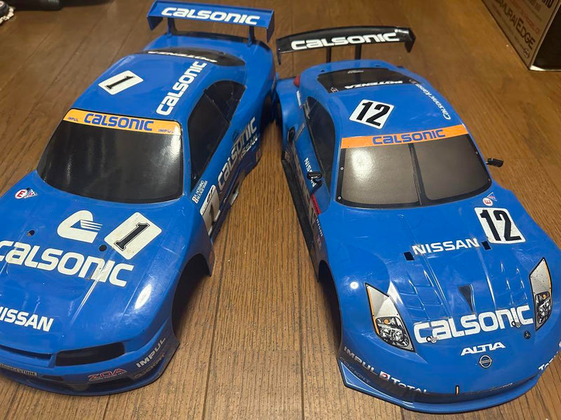 Load image into Gallery viewer, Used Tamiya Calsonic Skyline GT-R R33 RC Car with Z33 Body Set Used