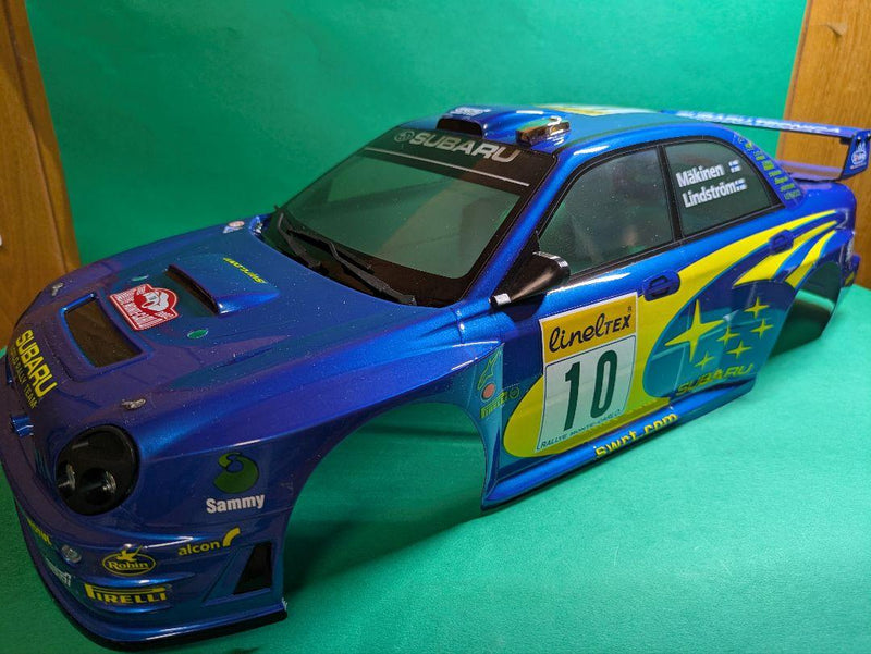 Laden Sie das Bild in Galerie -Viewer, Kyosho FAZER MK2 FZ02-R Subaru Impreza WRC 2002 ReadySet Unused Displayed Only - Used