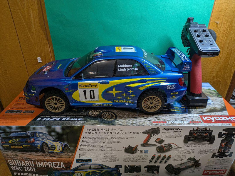Laden Sie das Bild in Galerie -Viewer, Kyosho FAZER MK2 FZ02-R Subaru Impreza WRC 2002 ReadySet Unused Displayed Only - Used