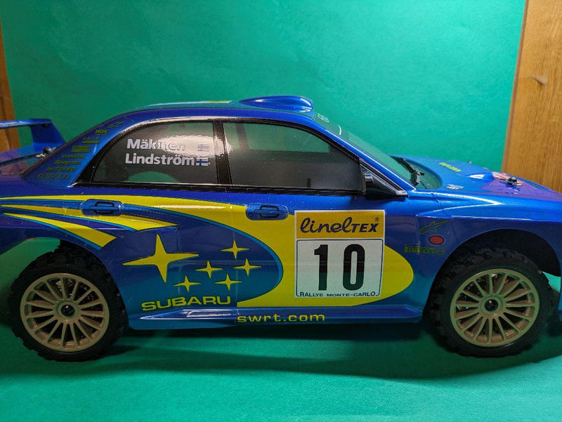Laden Sie das Bild in Galerie -Viewer, Kyosho FAZER MK2 FZ02-R Subaru Impreza WRC 2002 ReadySet Unused Displayed Only - Used