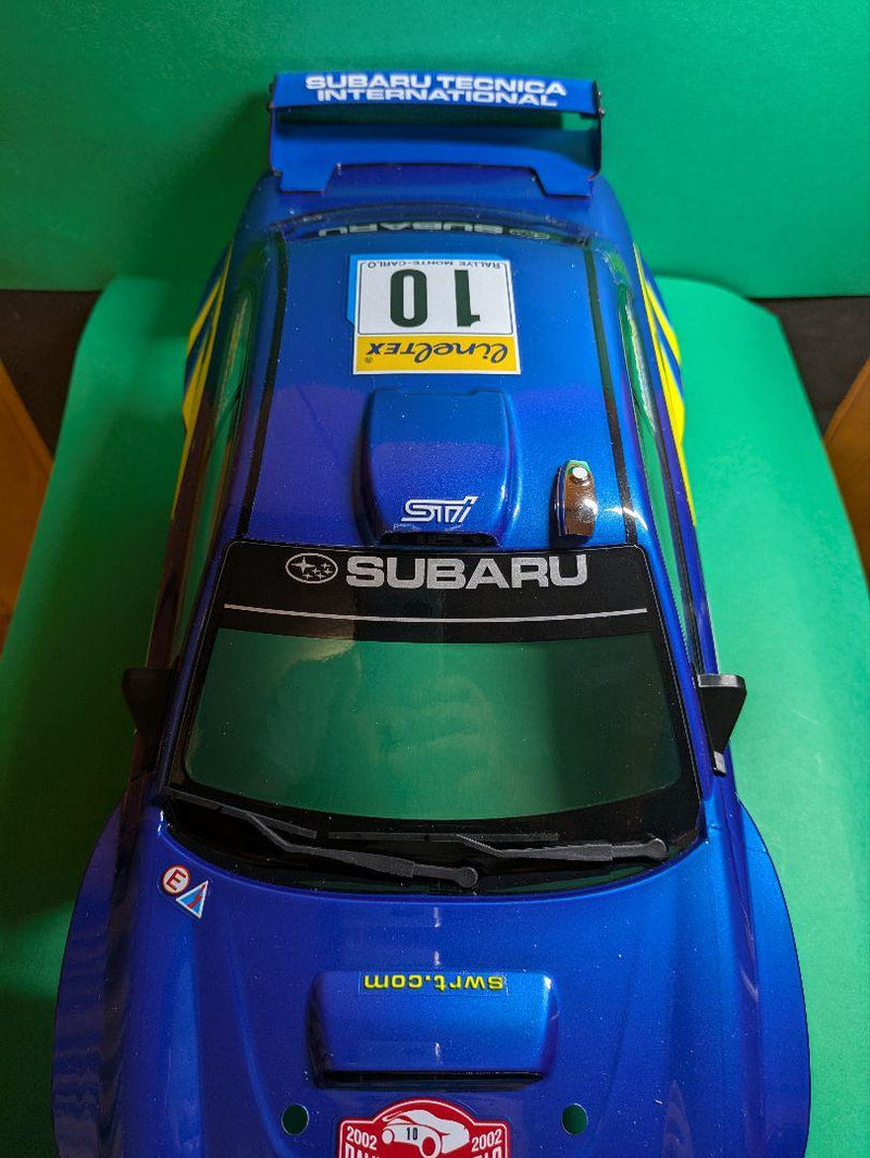 Laden Sie das Bild in Galerie -Viewer, Kyosho FAZER MK2 FZ02-R Subaru Impreza WRC 2002 ReadySet Unused Displayed Only - Used