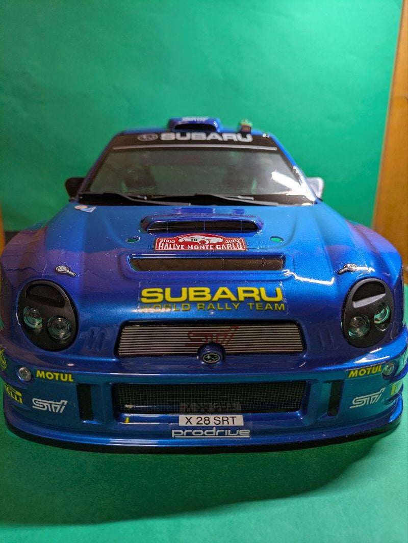 Laden Sie das Bild in Galerie -Viewer, Kyosho FAZER MK2 FZ02-R Subaru Impreza WRC 2002 ReadySet Unused Displayed Only - Used