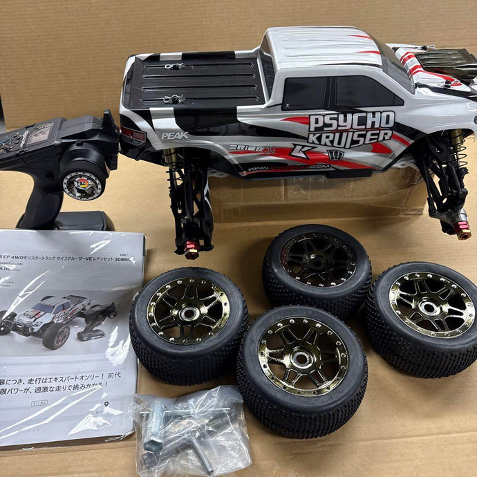 Used Kyosho 1/8 EP Psycho Kruiser RC Car Displayed with Manual and Tools