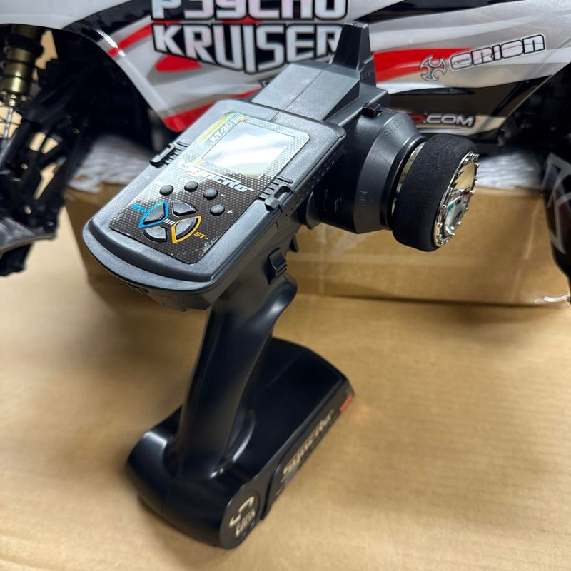 Load image into Gallery viewer, Used Kyosho 1/8 EP Psycho Kruiser RC Car Displayed with Manual and Tools
