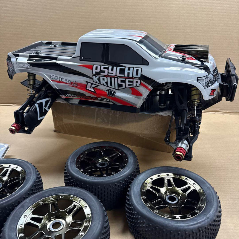 Load image into Gallery viewer, Used Kyosho 1/8 EP Psycho Kruiser RC Car Displayed with Manual and Tools
