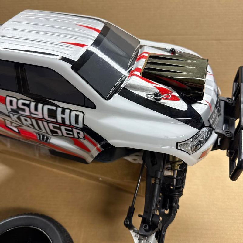 Load image into Gallery viewer, Used Kyosho 1/8 EP Psycho Kruiser RC Car Displayed with Manual and Tools
