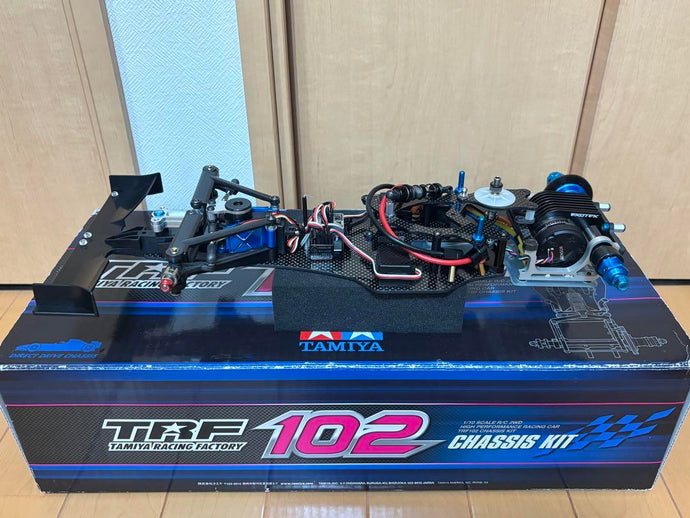 Used Tamiya TRF102 Partially Assembled with Futaba Electronics and Red Bull Body